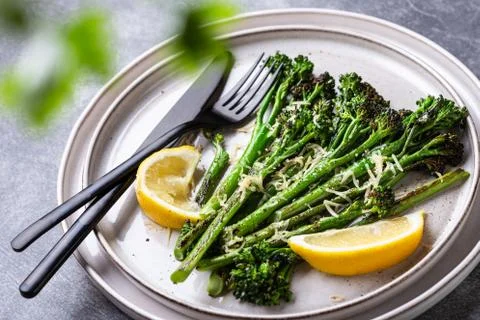 Roasted broccolini on the plate. Stock Photos