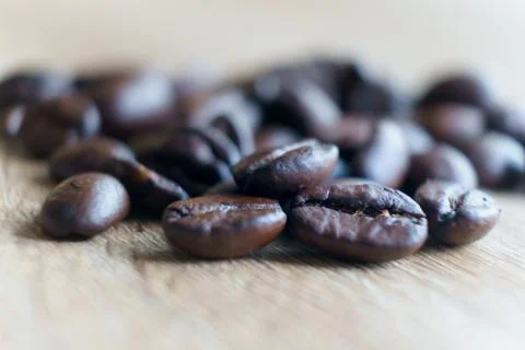 Roasted brown coffee bean Macro close up . Selective focus with copy space Stock Photos