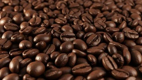 Roasted brown coffee beans background texture closeup Fotos de archivo