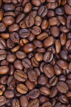 Roasted brown coffee beans pattern, background, top view Stock Photos