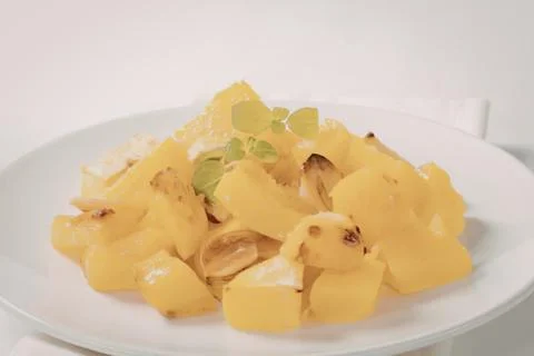Roasted caramelized orange and pineapple chunks Stock Photos