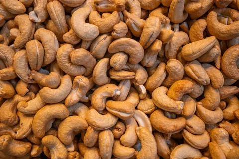 Roasted cashew nuts background texture. 写真素材