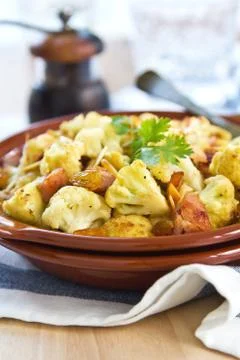 Roasted cauliflower with ham Stock Photos