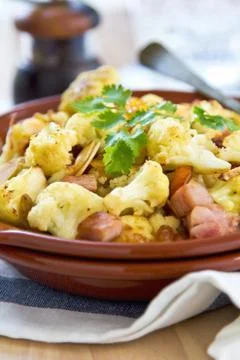 Roasted cauliflower with ham Stock Photos