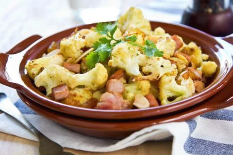 Roasted cauliflower with ham Stock Photos