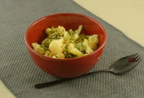 Roasted cauliflower with pepitas Stock Photos