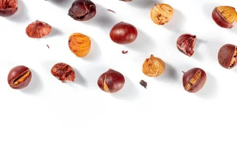 Roasted chestnuts background with a place for text, overhead flat lay shot Stock Photos