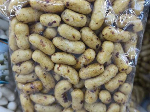 Roasted chestnuts in clear plastic bag. Stock Photos