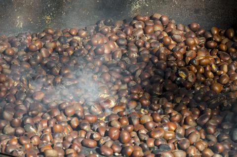 Roasted chestnuts cooked on the grill Stock Photos