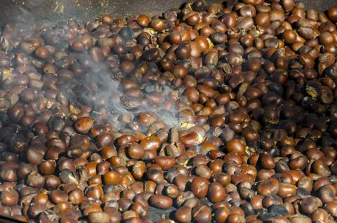 Roasted chestnuts cooked on the grill Stock Photos