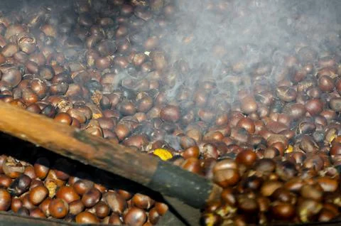 Roasted chestnuts cooked on the grill Stock Photos