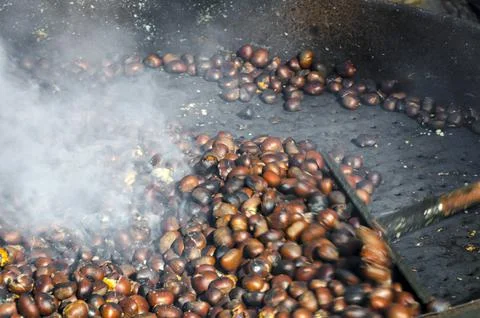 Roasted chestnuts cooked on the grill Stock Photos