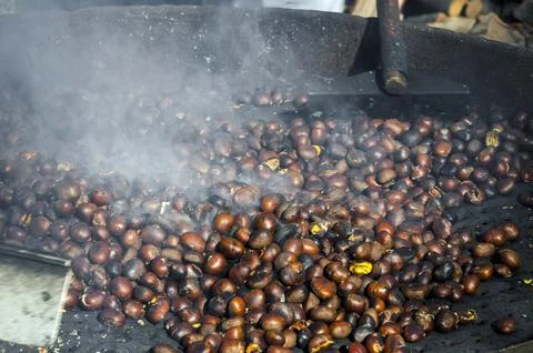 Roasted chestnuts cooked on the grill Stock Photos