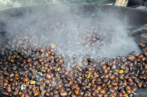 Roasted chestnuts cooked on the grill Stock Photos