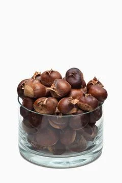Roasted chestnuts in a glass dish Stock Photos