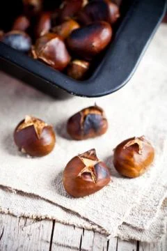 Roasted chestnuts in a pan Stock Photos