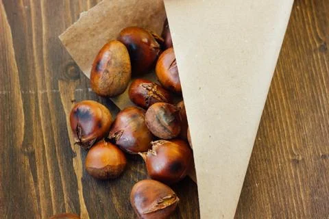 Roasted chestnuts in paper cornet Stock Photos