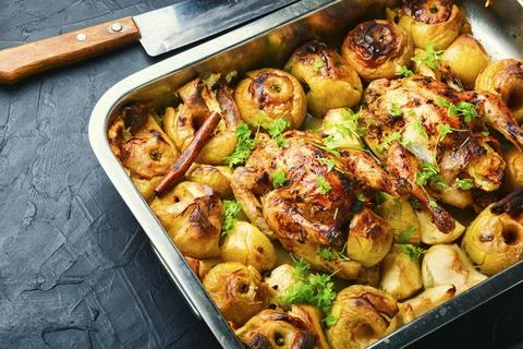 Roasted chicken with apples Stock Photos