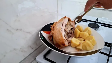 Roasted Chicken Carving with Boiled Potatoes on Kitchen Stove Stock Footage 341459257