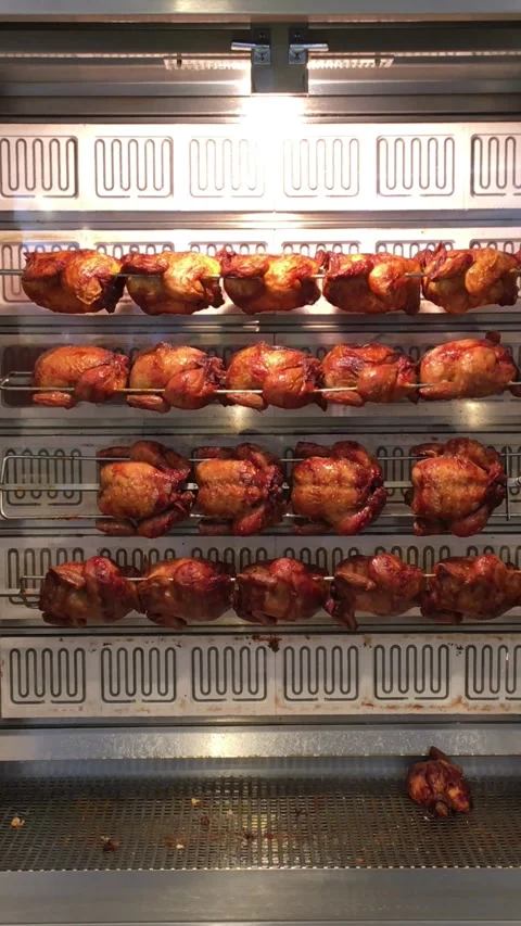 Roasted chicken drill, rotating white meat juicy crispy skin fast food street Stock Footage 276171800