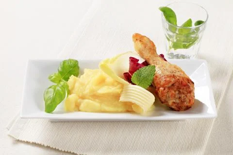 Roasted chicken drumstick and mashed potato Stock Photos