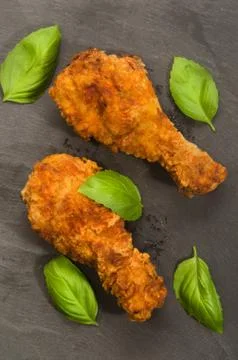 Roasted chicken drumstick with basil Stock Photos