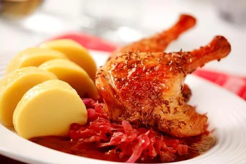 Roasted chicken drumsticks with mashed potatoes and red sauce Stock Photos