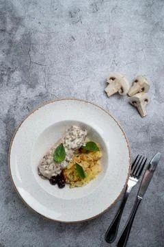 Roasted chicken fillet with smashed potatoes with golden crust Stock Photos