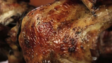 Roasted chicken grilled on fire, barbeque. In South America called "pollo a la b Stock Footage 65211138