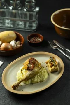 Roasted chicken leg served with mashed potatoes and cornbread Stock Photos