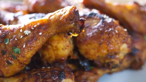 Roasted chicken legs BBQ in baking pan. Video shot 4K 50 fps. Stock Footage 118824548