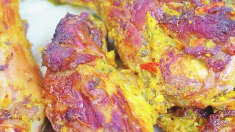 Roasted chicken legs with herbs and spices close up Stock Footage 341800736