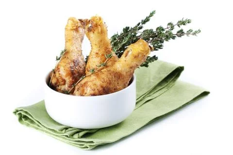 Roasted chicken legs with thyme Stock Photos