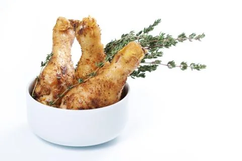 Roasted chicken legs with thyme Stock Photos