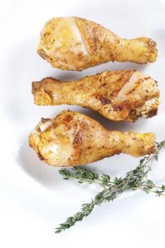 Roasted chicken legs with thyme Stock Photos