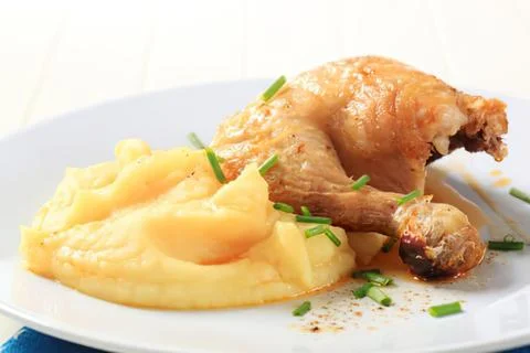 Roasted chicken with mashed potatoes on plate Stock Photos