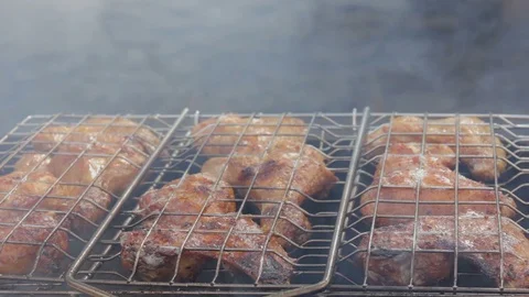 Roasted chicken meat is inverting on the grill. Stock Footage 87605619