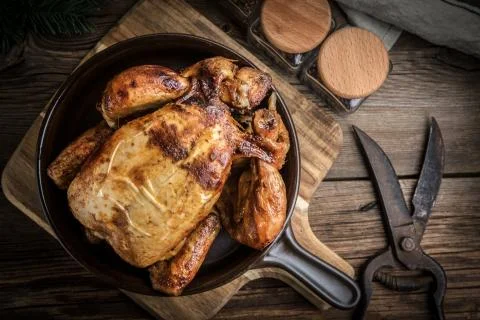 Roasted chicken on plate. Stock Photos