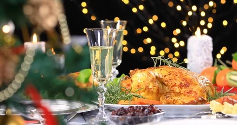 Roasted chicken ready to be served on Christmas festive table Stock Footage 119986720