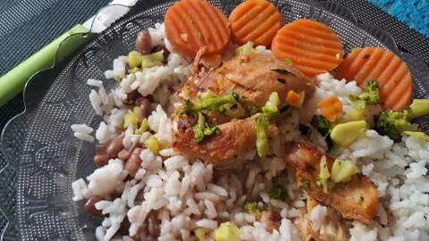 Roasted chicken with rice and vegetables motion footage meal plate Stock Footage 336252107