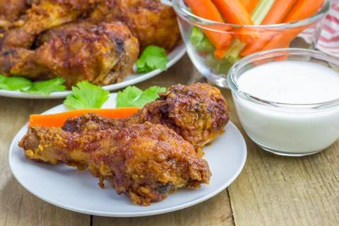 Roasted chicken served with celery and carrot sticks, blue cheese dressing an 스톡 사진