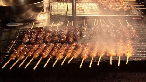 Roasted chicken sticks on grill. Stock Footage 122529019
