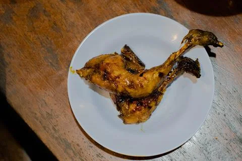 Roasted chicken in the white plate Stock Photos