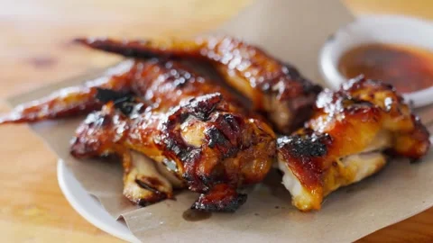 Roasted chicken wings on a plate Stock Footage 300850490