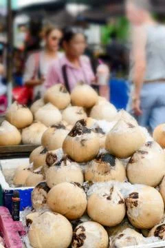 Roasted coconut for drinking in summer. Stock Photos