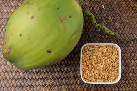 Roasted coconut in white cup. Stock Photos