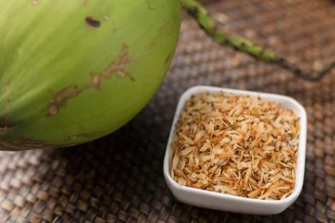 Roasted coconut in white cup. Stock Photos