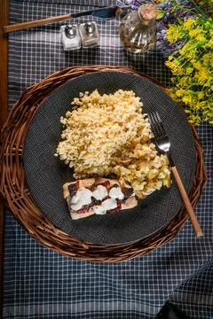 Roasted cod fish with bulgur. Stock Photos