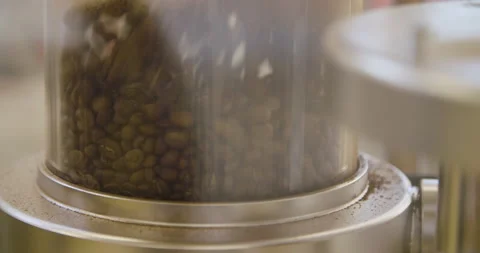 Roasted coffe beans in the machine Stock Footage 152447685