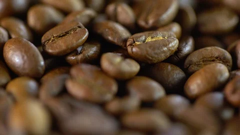 Roasted coffee bean. Fragrant coffee beans scrolls slowly around the camera Видео 119972241